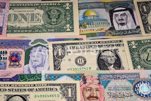 USD American dollars and Saudi Arabian riyals SAR banknotes cash money bills, of different times, eras and values, Saudi Arabia riyals money and Ameri
