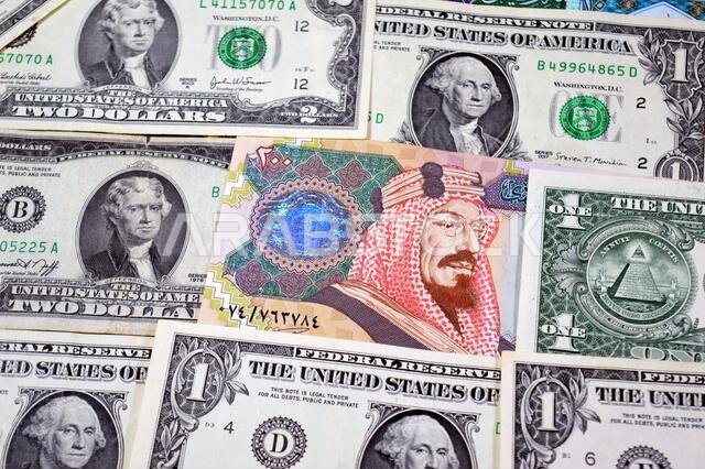 USD American dollars and Saudi Arabian riyals SAR banknotes cash money bills, of different times, eras and values, Saudi Arabia riyals money and Ameri