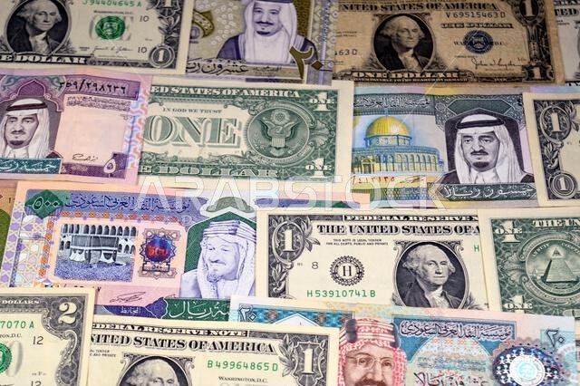 USD American dollars and Saudi Arabian riyals SAR banknotes cash money bills, of different times, eras and values, Saudi Arabia riyals money and Ameri