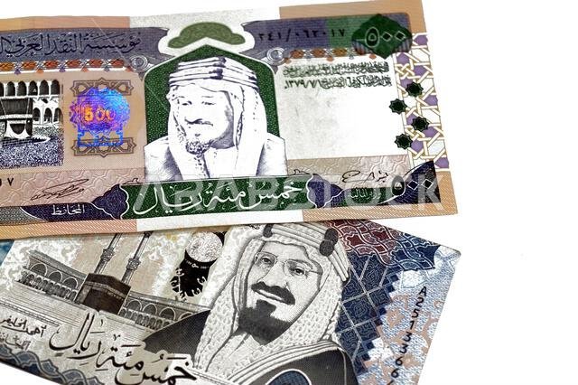The obverse sides of old and new 500 SAR five hundred Saudi riyals cash money banknote bill, features The Kaaba Ka'aba, inside the Great Mosque of Mec