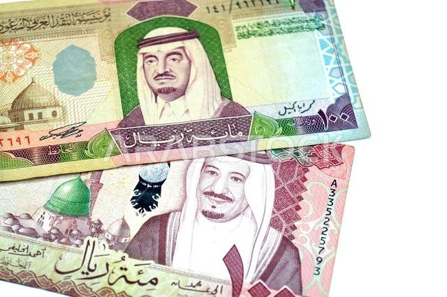 obverse sides of 100 SAR one hundred Saudi Arabian riyals cash money banknote bills, features king Fahd and king Salman Bin AbdulAziz and the Prophet'
