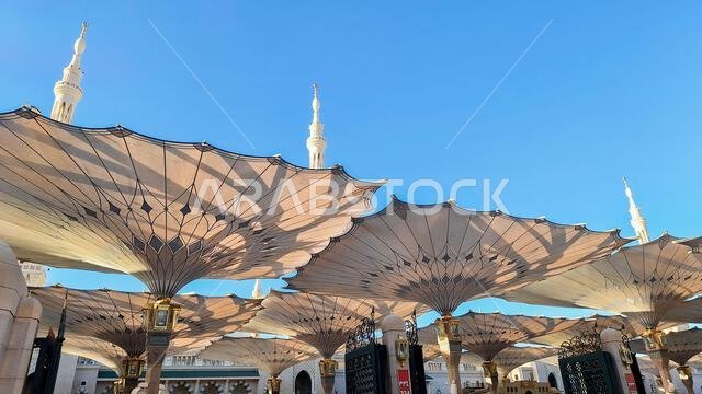 Medina, Saudi Arabia - March 7, 2024: Exterior architecture of giant umbrella at the Masjid an-Nabawi Medina, Saudi Arabia - March 7, 2024: Exterior architecture of giant umbrella at the Masjid an-Nabawi