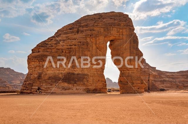 Jabal AlFil - Elephant Rock in Al Ula desert landscape, bright sun behind