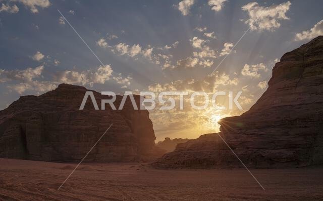 Morning sun shines over rocky desert formations, typical landscape in Al Ula, Saudi Arabia