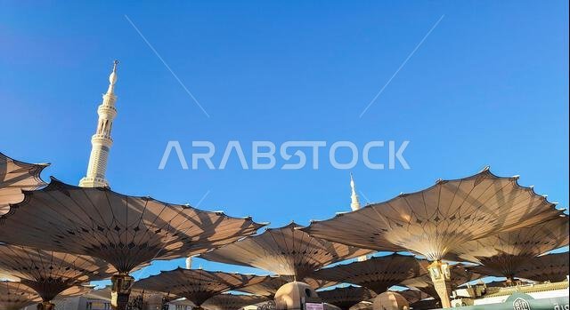 Medina, Saudi Arabia - March 7, 2024: Exterior architecture of giant umbrella at the Masjid an-Nabawi