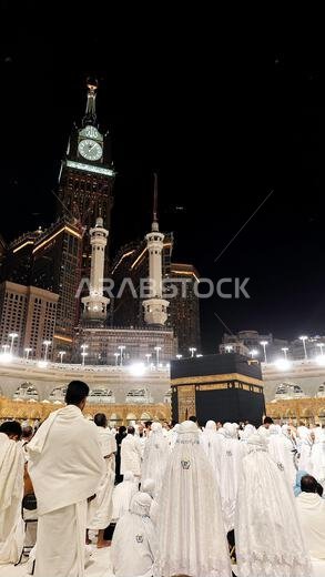 Mecca, Saudia Arabia - March 8, 2024: Muslim pilgrims performing tawaf around the Kaaba and praying at Masjid al-Haram during umrah season