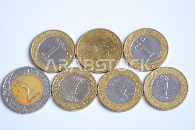 Pekanbaru, Indonesia - September 19, 2025: Various Saudi Arabia riyal coins isolated on white background