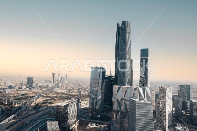 Aerial drone view of King Abdullah Financial District (KAFD) in Riyadh, Saudi Arabia, showing modern skyscrapers and futuristic architecture. Aerial drone view of King Abdullah Financial District (KAFD) in Riyadh, Saudi Arabia, showing modern skyscrapers and futuristic architecture.