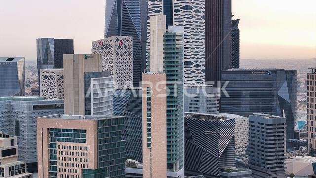 Aerial drone view of King Abdullah Financial District (KAFD) in Riyadh, Saudi Arabia, showing modern skyscrapers and futuristic architecture. Aerial drone view of King Abdullah Financial District (KAFD) in Riyadh, Saudi Arabia, showing modern skyscrapers and futuristic architecture.