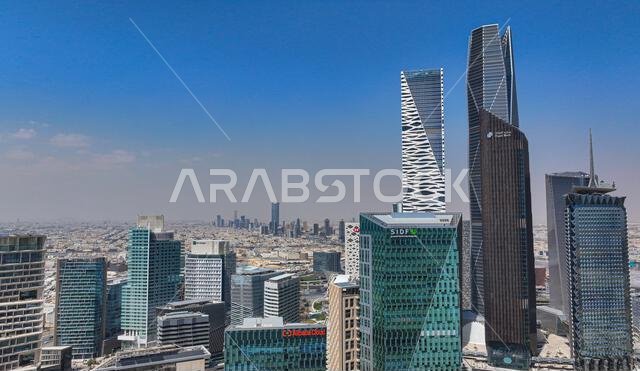 Aerial drone view of King Abdullah Financial District (KAFD) in Riyadh, Saudi Arabia, showing modern skyscrapers and futuristic architecture. Aerial drone view of King Abdullah Financial District (KAFD) in Riyadh, Saudi Arabia, showing modern skyscrapers and futuristic architecture.