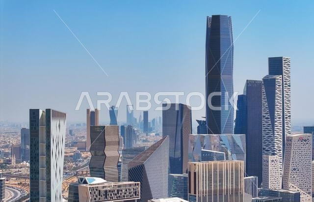 Aerial drone view of King Abdullah Financial District (KAFD) in Riyadh, Saudi Arabia, showing modern skyscrapers and futuristic architecture. Aerial drone view of King Abdullah Financial District (KAFD) in Riyadh, Saudi Arabia, showing modern skyscrapers and futuristic architecture.