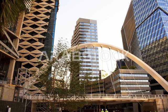 Aerial drone view of King Abdullah Financial District (KAFD) in Riyadh, Saudi Arabia, showing modern skyscrapers and futuristic architecture. Aerial drone view of King Abdullah Financial District (KAFD) in Riyadh, Saudi Arabia, showing modern skyscrapers and futuristic architecture.