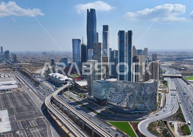 Aerial drone view of King Abdullah Financial District (KAFD) in Riyadh, Saudi Arabia, showing modern skyscrapers and futuristic architecture. Aerial drone view of King Abdullah Financial District (KAFD) in Riyadh, Saudi Arabia, showing modern skyscrapers and futuristic architecture.