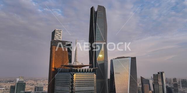 Aerial drone view of King Abdullah Financial District (KAFD) in Riyadh, Saudi Arabia, showing modern skyscrapers and futuristic architecture. Aerial drone view of King Abdullah Financial District (KAFD) in Riyadh, Saudi Arabia, showing modern skyscrapers and futuristic architecture.