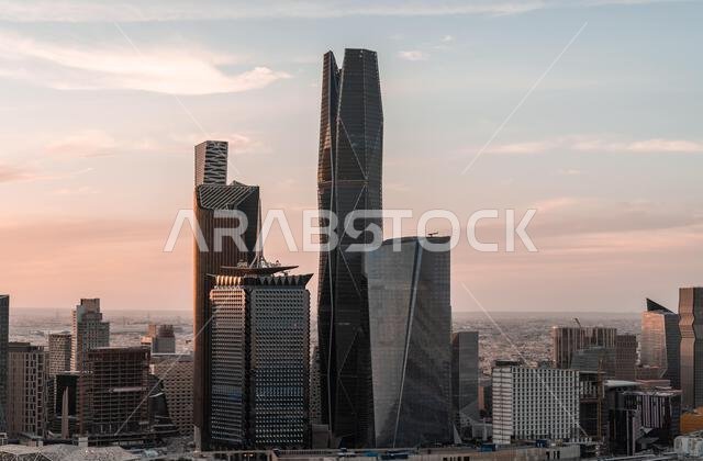 Aerial drone view of King Abdullah Financial District (KAFD) in Riyadh, Saudi Arabia, showing modern skyscrapers and futuristic architecture. Aerial drone view of King Abdullah Financial District (KAFD) in Riyadh, Saudi Arabia, showing modern skyscrapers and futuristic architecture.