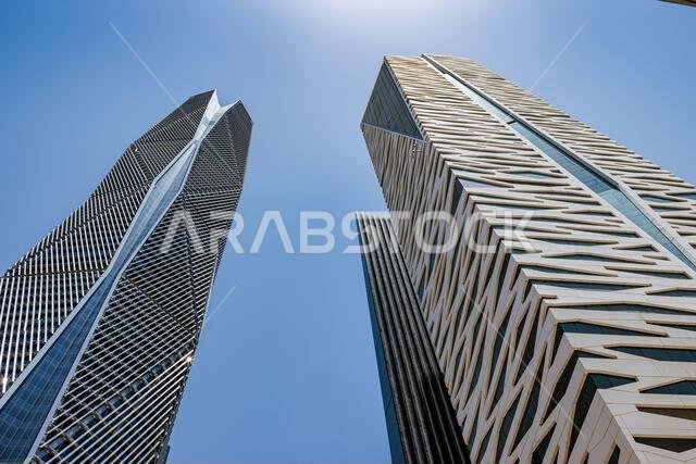 Aerial drone view of King Abdullah Financial District (KAFD) in Riyadh, Saudi Arabia, showing modern skyscrapers and futuristic architecture. Aerial drone view of King Abdullah Financial District (KAFD) in Riyadh, Saudi Arabia, showing modern skyscrapers and futuristic architecture.