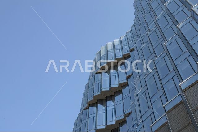 Aerial drone view of King Abdullah Financial District (KAFD) in Riyadh, Saudi Arabia, showing modern skyscrapers and futuristic architecture. Aerial drone view of King Abdullah Financial District (KAFD) in Riyadh, Saudi Arabia, showing modern skyscrapers and futuristic architecture.