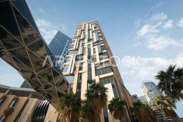 Aerial drone view of King Abdullah Financial District (KAFD) in Riyadh, Saudi Arabia, showing modern skyscrapers and futuristic architecture. Aerial drone view of King Abdullah Financial District (KAFD) in Riyadh, Saudi Arabia, showing modern skyscrapers and futuristic architecture.