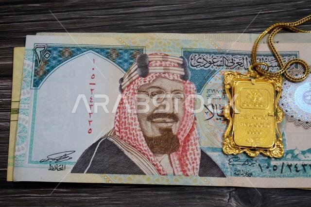 Cairo, Egypt, October 29 2025: A PAMP Suisse gold bar pendant on SAR Saudi riyals, 24K Gold Bar Half Ounce 15.55 Grams, pure fine gold 999.9, for inve