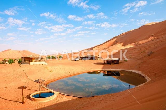 camp in the desert with thermal pool with therapeutic properties in Oman Empty Quarter desert and saudi arabia, Persian Gulf, Middle East.