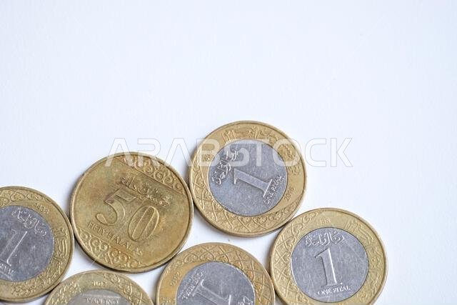 Pekanbaru, Indonesia - September 19, 2025: Various Saudi Arabia riyal coins isolated on white background
