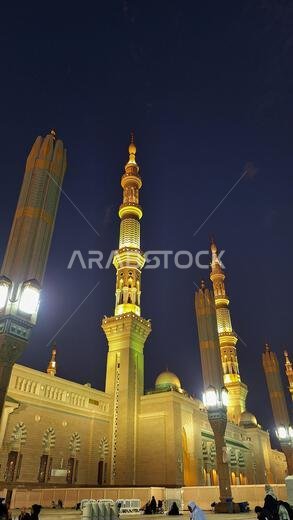 Madinah, Saudi Arabia - March 6, 2024: The atmosphere in the courtyard of Masjid an-Nabawi at dusk