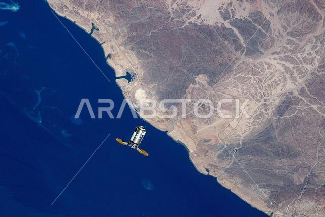 The Northrop Grumman Cygnus unmanned space freighter approaches the International Space Station orbiting 261 miles above the Red Sea in Saudi Arabia A photograph taken from the International Space Station on 4 August 2023. An optimised version of an original NASA image: Credit: NASA/WHoburg