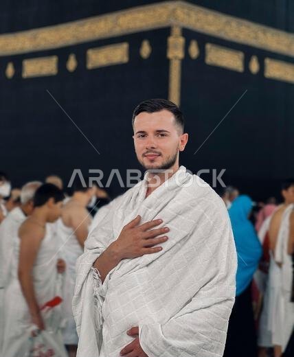 Muslim Man in Ihram Praying at Kaaba in Mecca During Hajj Pilgrimage Islamic Religious Tradition and Spirituality Saudi Arabia.
