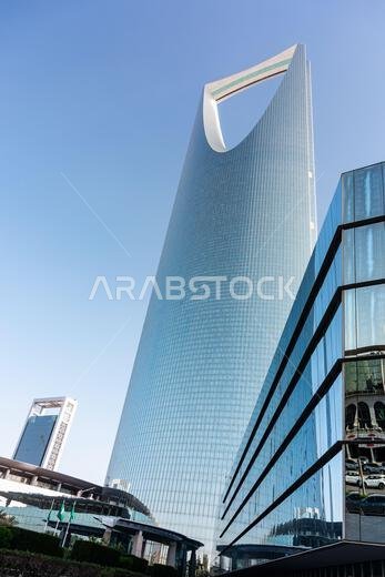 Riyadh, Saudi Arabia - January 1, 2026: A striking glass skyscraper the Kingdom Centre in Riyadh features a distinctive loop arch near the top, reflec