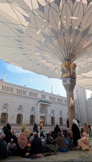 Medina, Saudi Arabia - March 6, 2024: The atmosphere in the courtyard of Al-Masjid an-Nabawi before prayer
