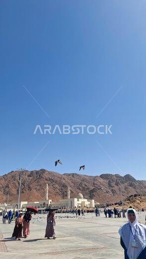 Medina, Saudi Arabia - March 6, 2024: Pilgrims visiting Mount Uhud Medina, Saudi Arabia - March 6, 2024: Pilgrims visiting Mount Uhud