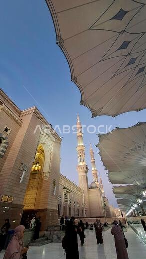 Medina, Saudi Arabia - March 7, 2024: The atmosphere in the courtyard of Al-Masjid an-Nabawi at dawn