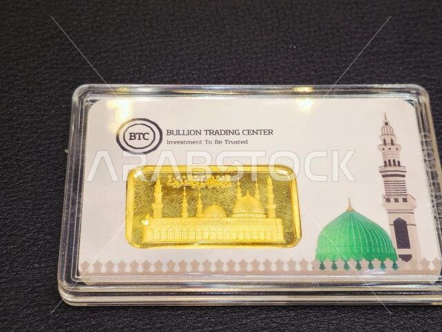 Cairo, Egypt, January 13 2026: A BTC Bullion Trading Center gold ounce bar, which weighs 31.10 grams, features the prophet's mosque or Al Masjid Al Na