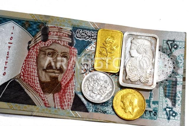 The Saudi Arabian riyals money SAR and 24K gold and pure fine silver bars and sovereign coins, for investment or savings, gold and silver with highest