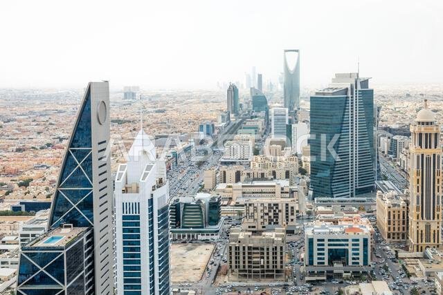 Contemporary cityscape with futuristic high rise architecture, corporate towers and dense urban downtown development representing economic growth, Al