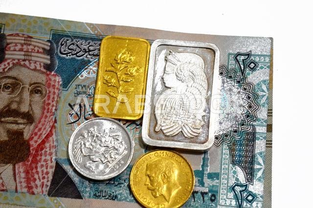 The Saudi Arabian riyals money SAR and 24K gold and pure fine silver bars and sovereign coins, for investment or savings, gold and silver with highest
