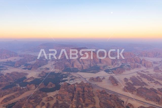 An aerial view of Hegra and surroundings at first light from a hot air balloon near AlUla, Saudi Arabia