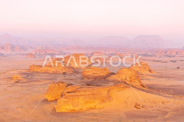 An aerial view of Hegra and surroundings at first light from a hot air balloon near AlUla, Saudi Arabia
