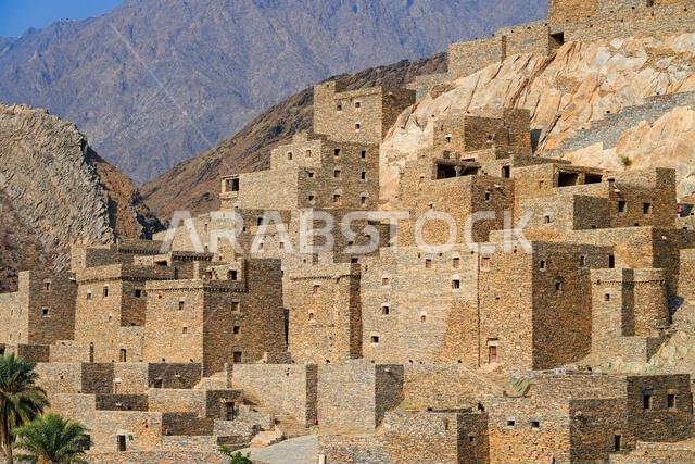 Thee Ain Heritage Village, the famous marble village of Al-Baha against a desert mountain backdrop in Saudi Arabia