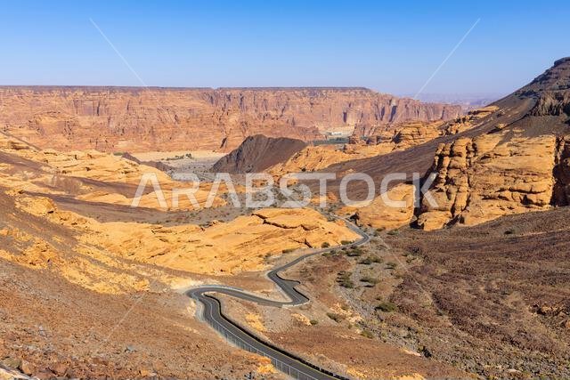 Panoramic views across the road leading up to the outdoor seating area at the Harrat Viewpoint near AlUla, Saudi Arabia