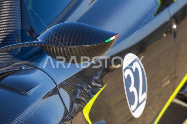 A leaf-shaped rear-view mirror of a Pagani Huayra Roadster at the Desert Mirage 2026 race in Al Ula, Saudi Arabia