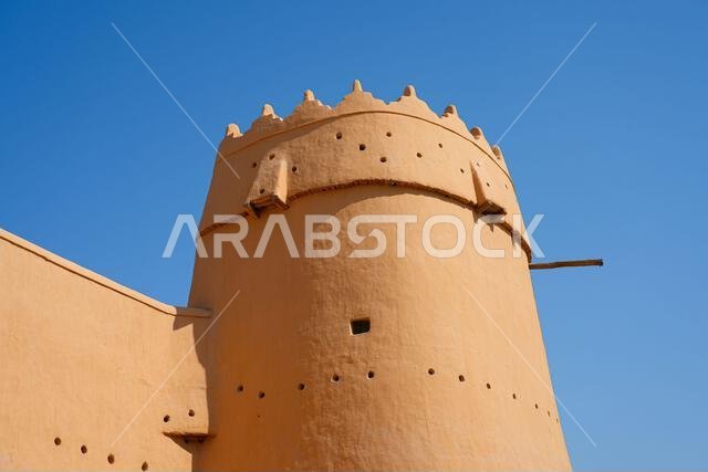 Detailed view of a traditional mud-brick watchtower at Al Masmak Fortress in the heart of Riyadh, Saudi Arabia
