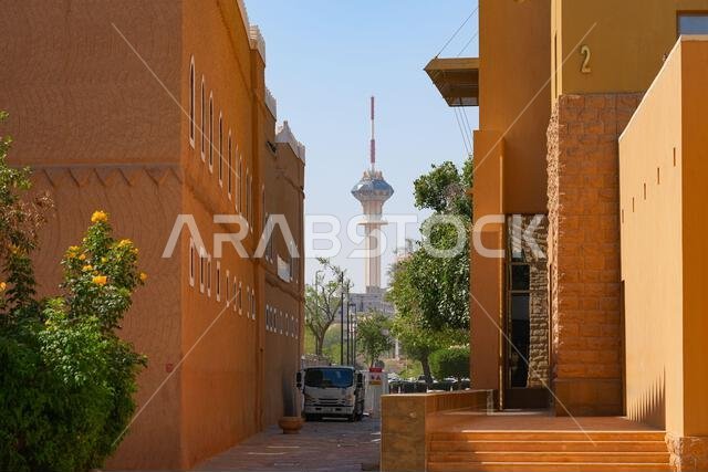 Riyadh TV Tower framed by the traditional Najdi architecture of Murabba Palace in Saudi Arabia