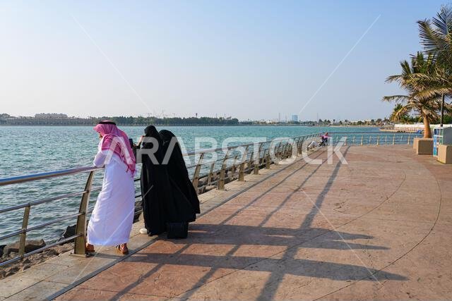People enjoying the sea view at the Jeddah Corniche, a waterfront promenade on the Red Sea coast in Saudi Arabia
