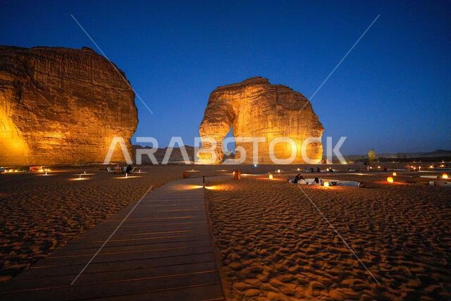 Wooden boardwalk leading to the iconic Elephant Rock in AlUla at dusk, Saudi Arabia