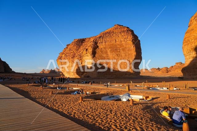Sandstone rock formation next to Elephant Rock (Jabal Al-Fil) at sunset in the desert of AlUla, Saudi Arabia