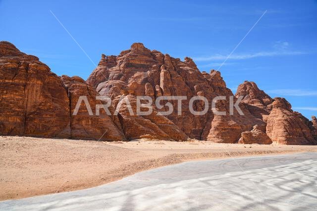 The Maraya mirrored concert hall reflecting the ancient desert mountains of Ashar Valley in AlUla, Saudi Arabia
