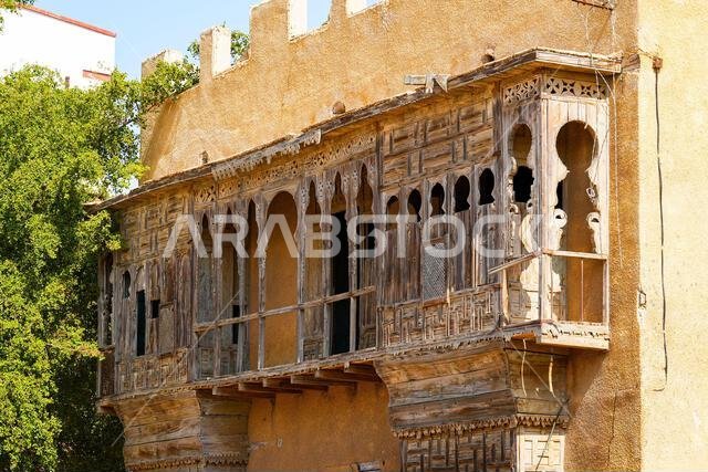 Intricate wooden roshan balconies in the historic Al-Balad district of Yanbu, Saudi Arabia