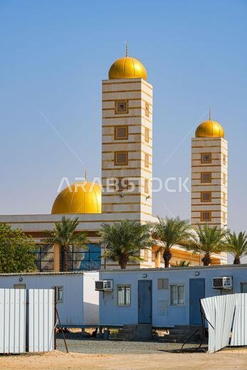 The modern Sharbatly Mosque with golden domes in King Abdullah Economic City (KAEC), Saudi Arabia