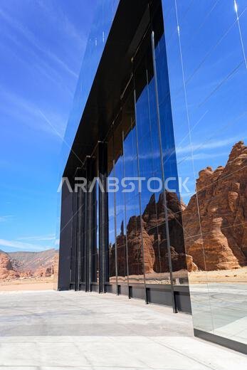 The Maraya mirrored concert hall reflecting the ancient desert mountains of Ashar Valley in AlUla, Saudi Arabia